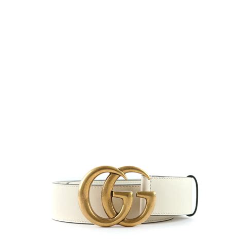 white gucci belt gold buckle.